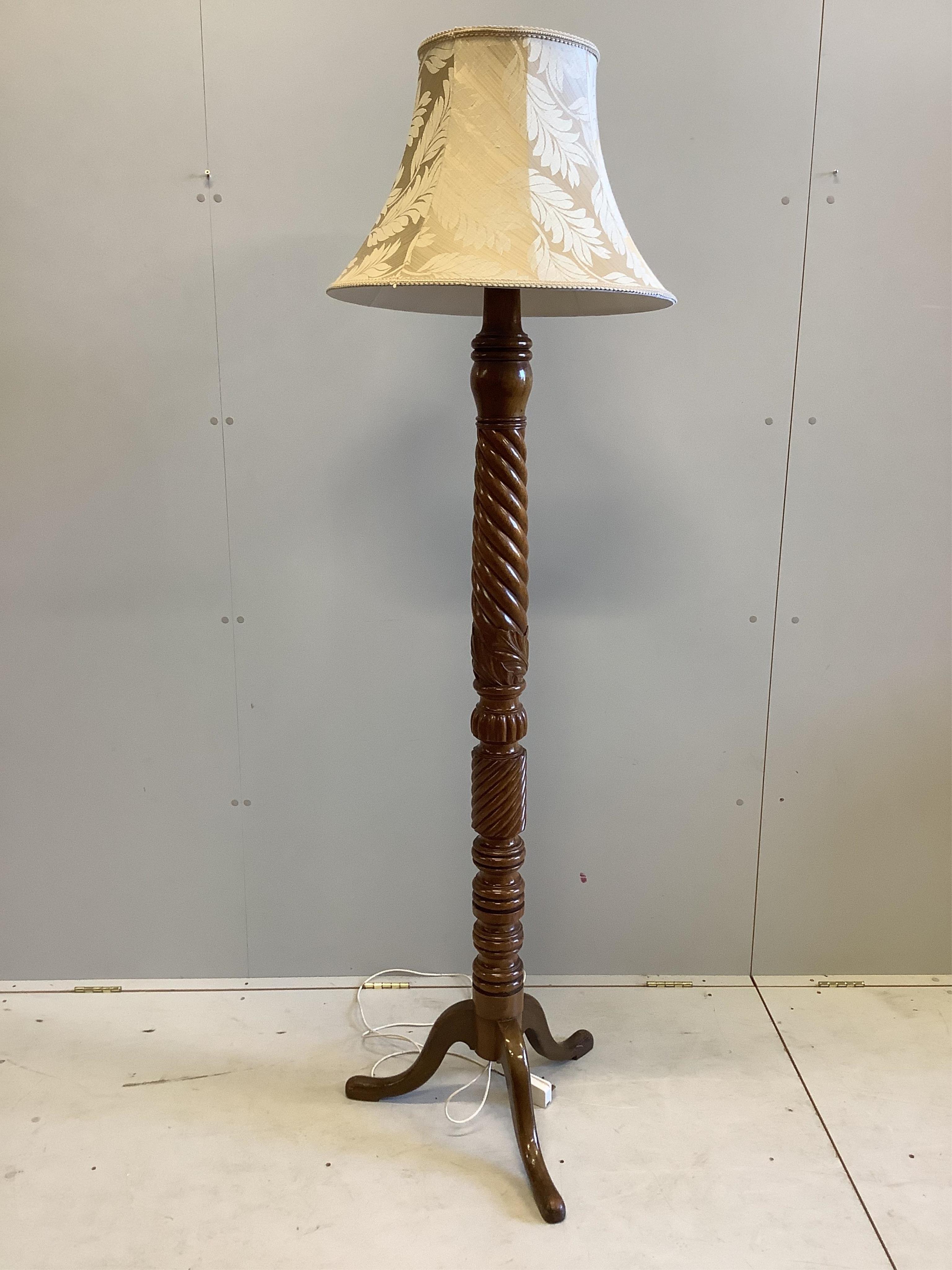 A mahogany bedpost torchere stand, height 190cm including shade. Condition - good